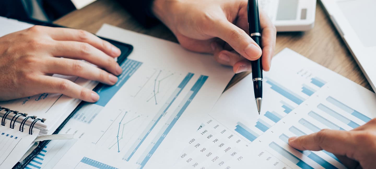FiscalForge tax professionals reviewing financial charts and reports